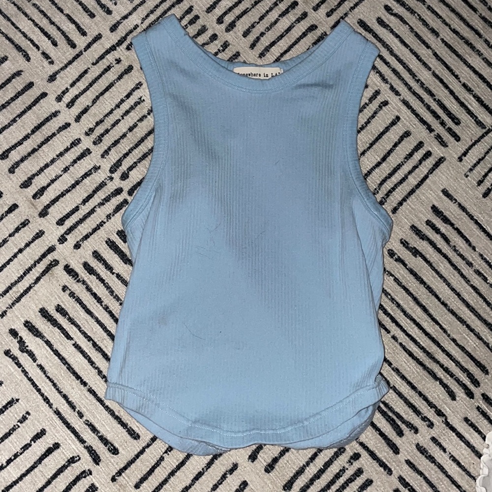 Baby blue tank top. Stretchy material. Good for hanging out with friends